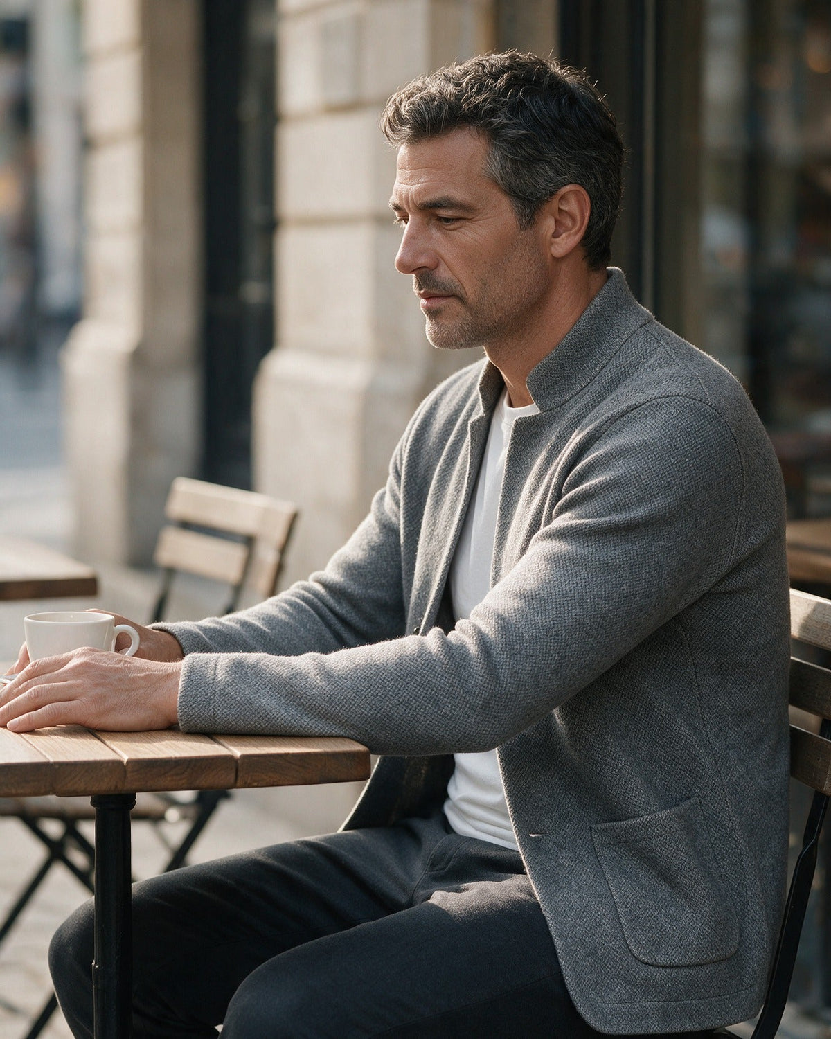 Ashby men's knit blazer in Gray, worn at a café