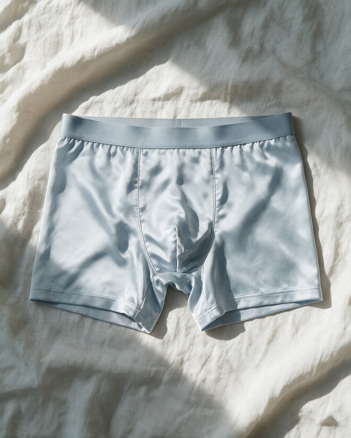 Mayfair men's silk-blend boxer in Light Blue, laid open, showing the two curved front seams