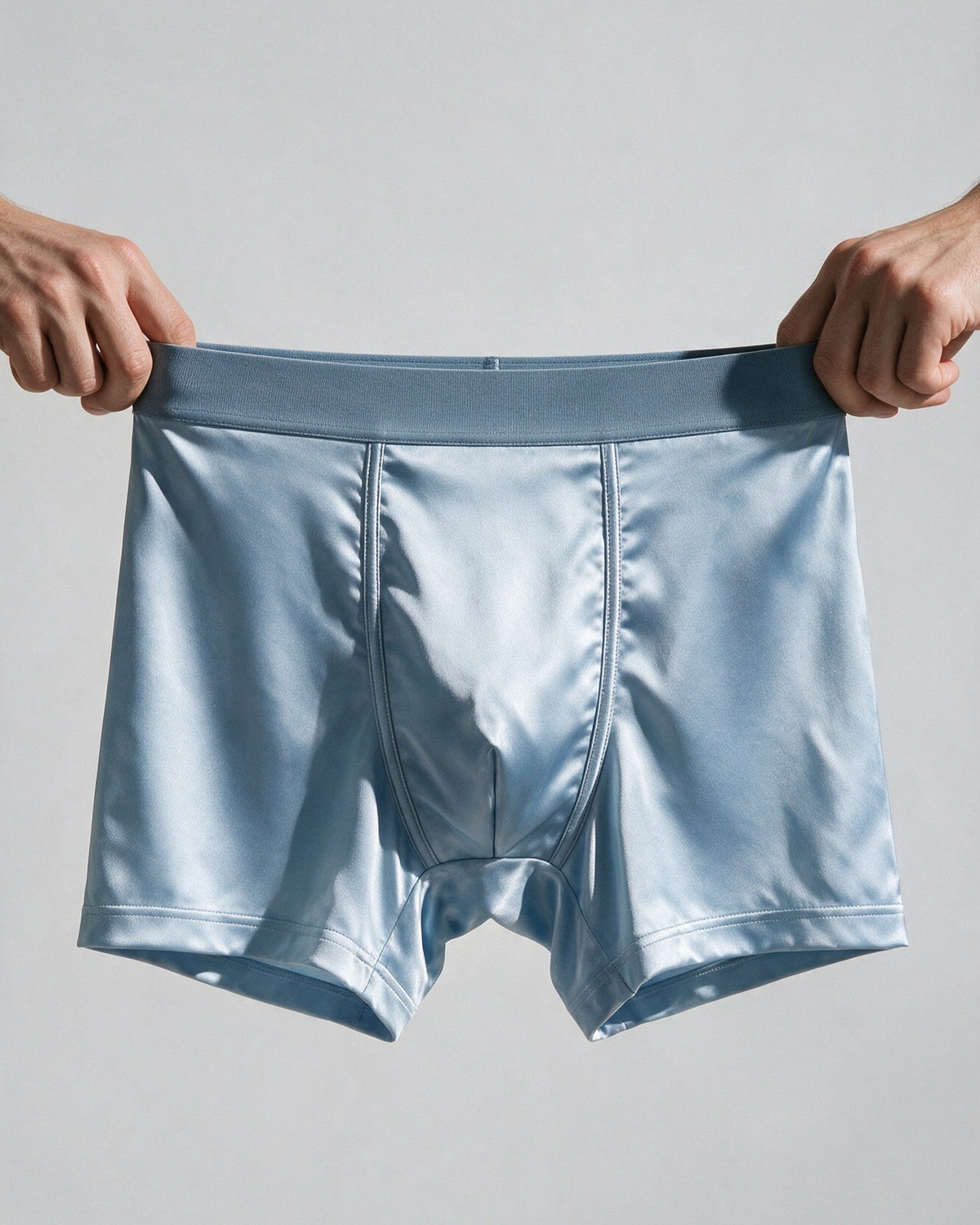 Mayfair men's silk-blend boxer in Light Blue, the wide, plain waistband stretched by hand