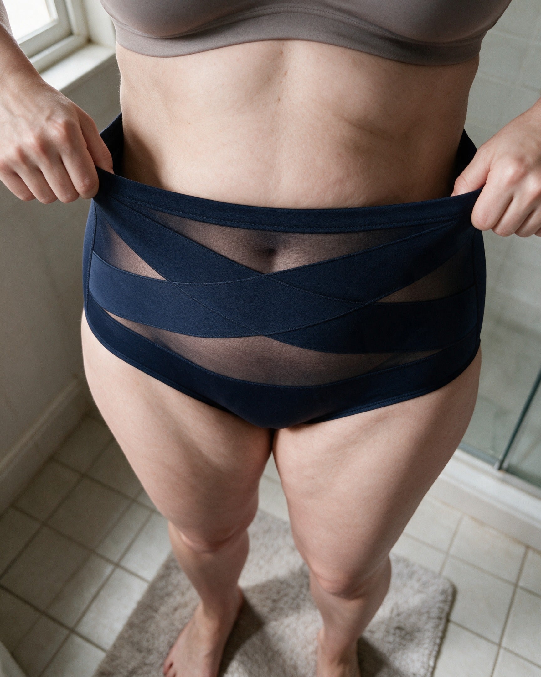 Haven brief in Navy, pulling it on