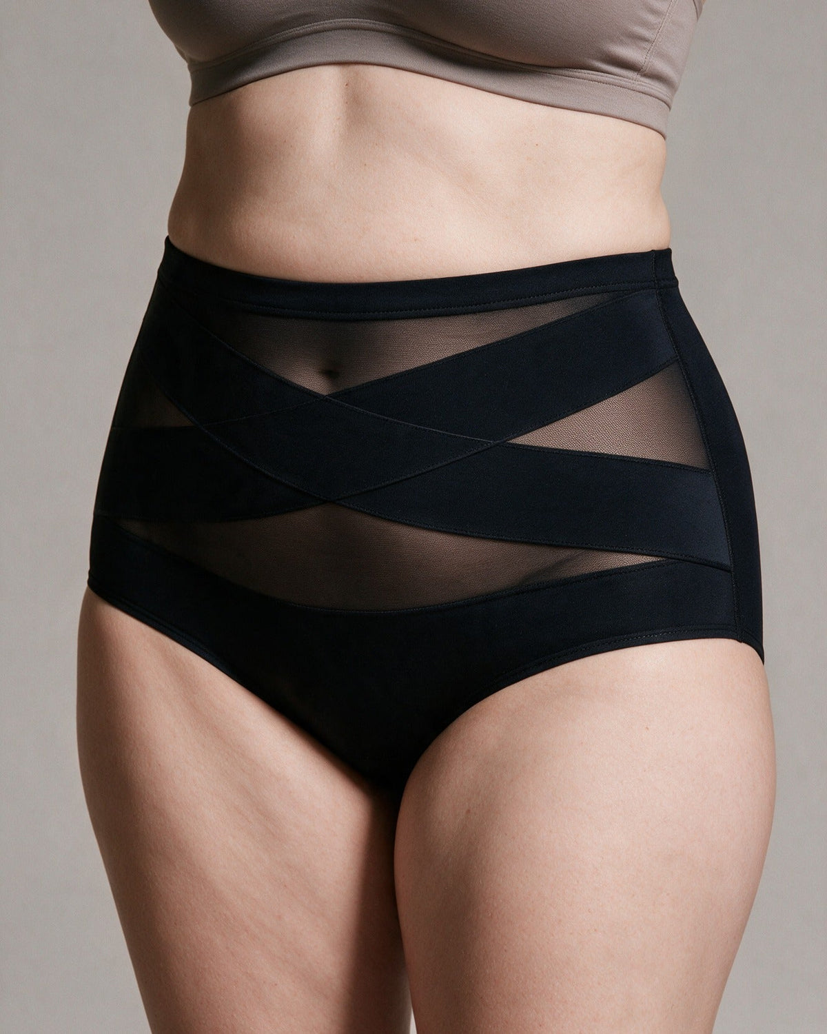 Haven Postpartum Support Brief in Black, crossed X bands close-up