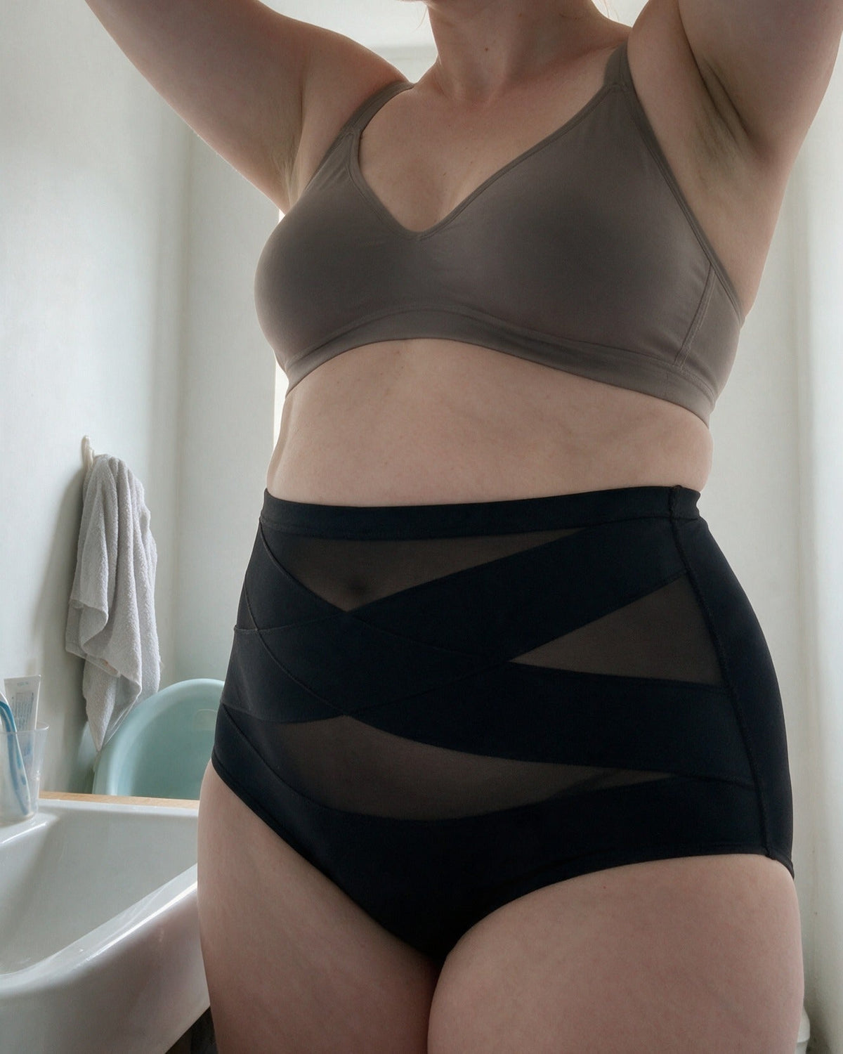 Haven Postpartum Support Brief in Black, everyday moment at home