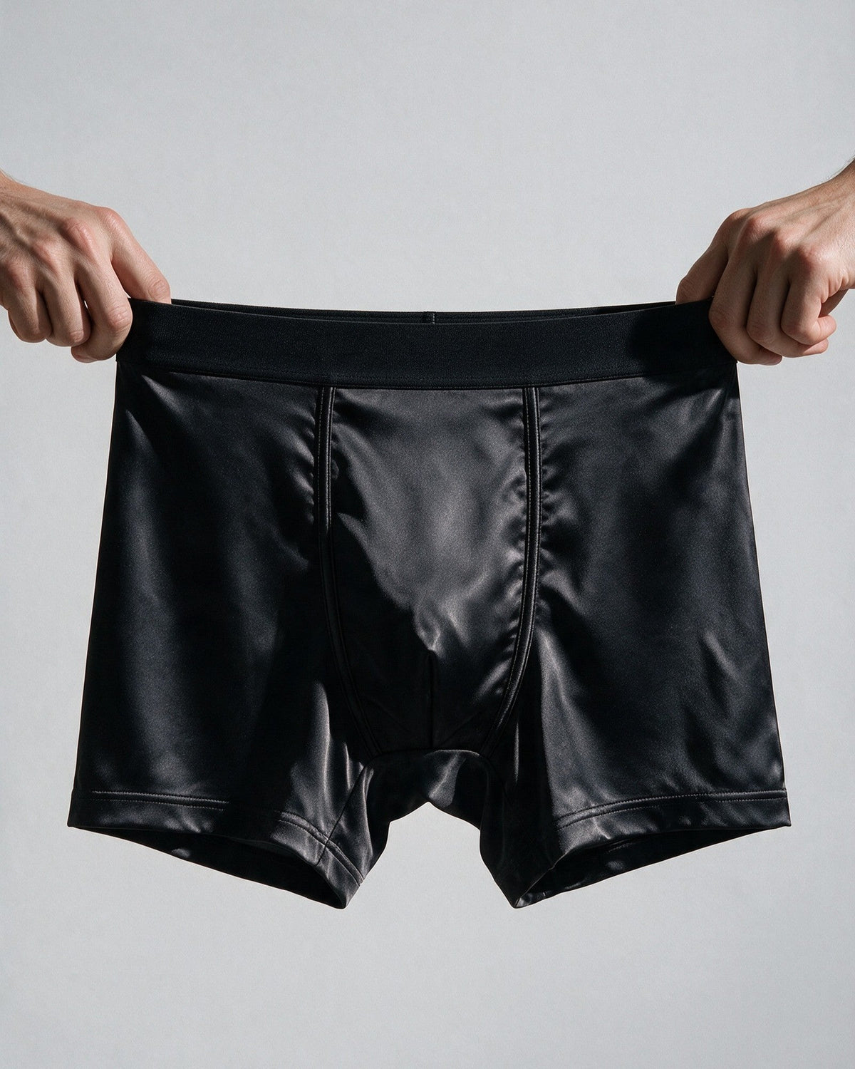 Mayfair men's silk-blend boxer in Black, the wide, plain waistband stretched by hand