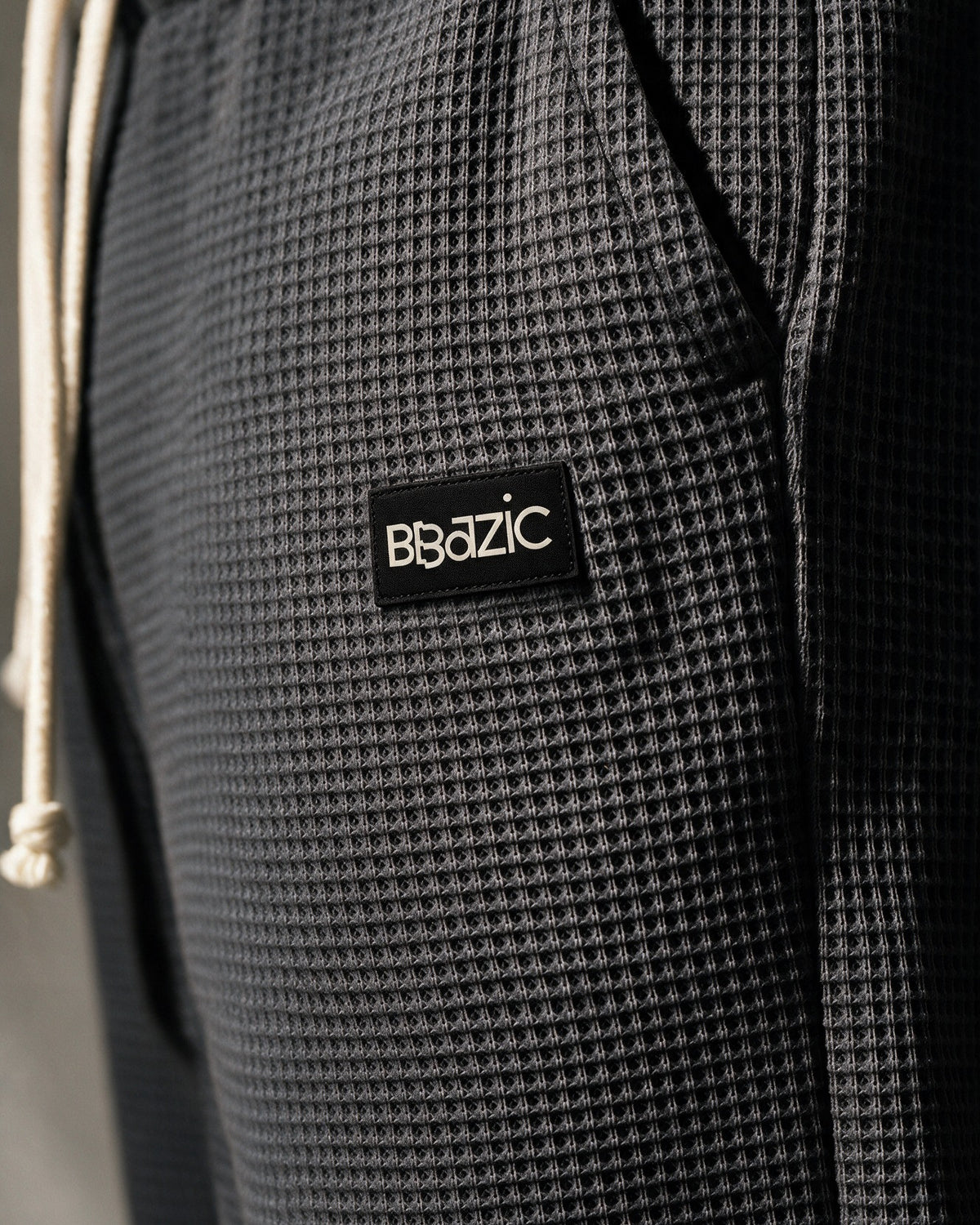 Softloom waffle pants in Black, woven BBazic label close-up