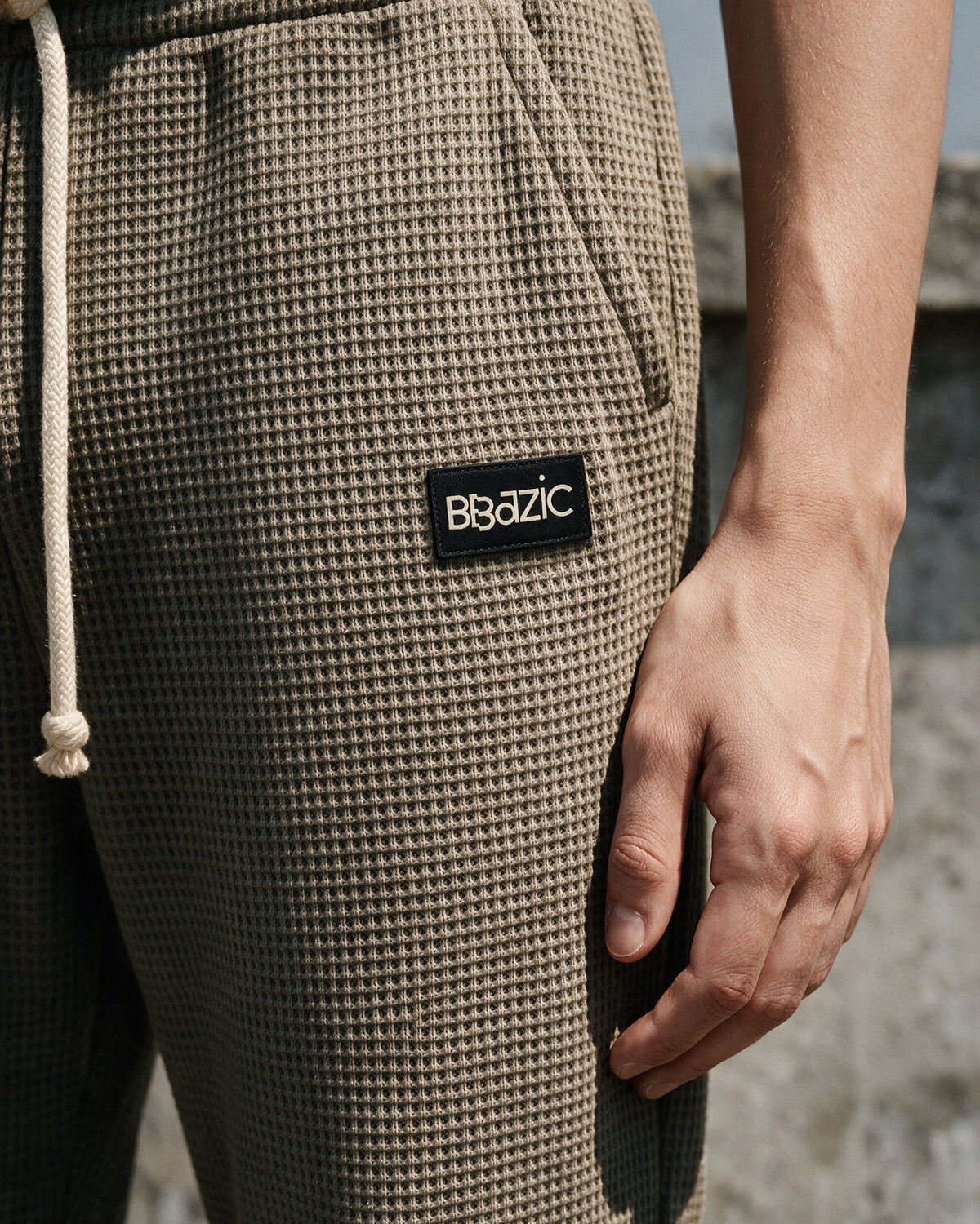Side pocket and BBazic woven label on khaki Softloom pants